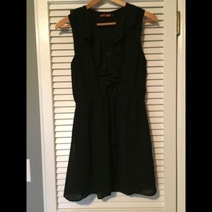 Black sleeveless dress. With ruffle at neckline